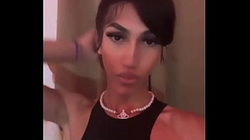 Young Sissy Tgirl Crossdressing in Sexy Black Cheerleader Outfit