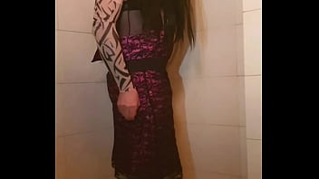 Transvestite slips out of her dress