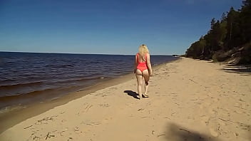 Blonde flashing pussy on the beach