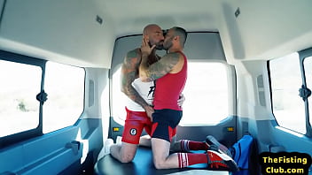 Tattooed hunky top fisting lubed asshole during duo in van