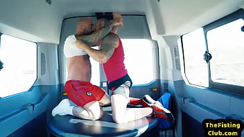 Tattooed hunky top fisting lubed asshole during duo in van
