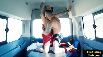 Tattooed hunky top fisting lubed asshole during duo in van