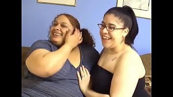 Two fat girls enjoy some fine dining in by sucking tits and pussies