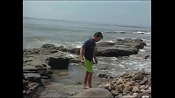 Slim beauty with small tits enjoys fucking with a muscular guy on a nude beach