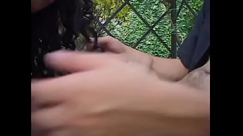 Busty shemale in pink lingerie fucks a horny dude in a park on a bench