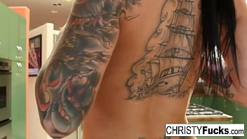 Hot Christy Mack plays with her amazing tits and wet pussy on the kitchen counter