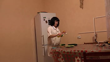 Big cucumber fucks shaved pussy in oil. A brunette with a beautiful ass and in stockings masturbates in the kitchen on the floor Fetish