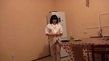 Big cucumber fucks shaved pussy in oil. A brunette with a beautiful ass and in stockings masturbates in the kitchen on the floor Fetish