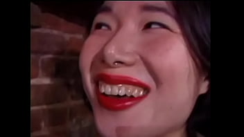 Two cheeky Asian whores in black stockings love to whip tied prisoners in the basement