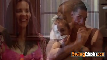 Sensual vibes in a room full of kinky swingers having a softcore orgy.