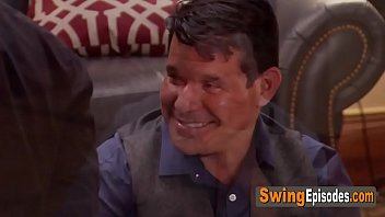 Sensual vibes in a room full of kinky swingers having a softcore orgy.