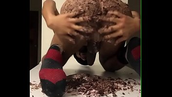 Hot black ass sitting on Raspberry Chocolate Cake