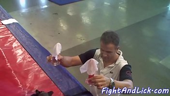 Asian lesbian rides strapon in a boxing ring