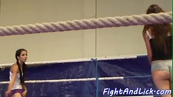 Skinny lesbians wrestling in a boxing ring
