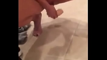 nail - polished girl with big boobs dildoes her shaved pussy in bathroom, while she films herself in
