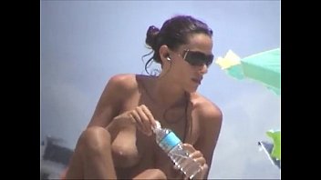 Debora Bello topless at the beach!
