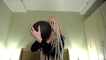 Blow big balloon and pop with long nails