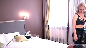 Genital by two Latex Dominas. Whipping, tying balls with ropes, bastinado