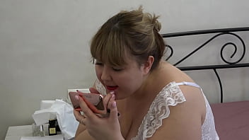 Beautiful face of a chubby milf behind the scenes. A mature BBW in a sexy outfit paints her lips. Amateur fetish.