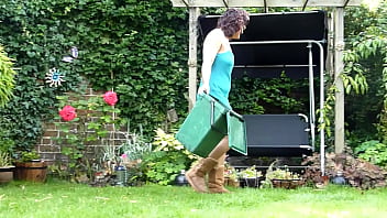 Wife watering and w.eeding the garden bending over showing upskirt and flashing her ass and shaved pussy to the neighbors.