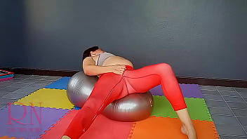 Regina Noir. A woman in yoga leotards practices yoga in the gym. Transparent red leotard yoga. pantyhose c3