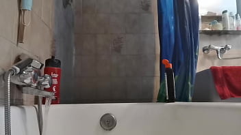 Italian stepmom wets her pantyhose in the shower to turn you on