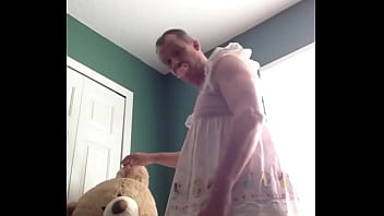 ABDL diapered sissy in pretty pink dress with teddybear