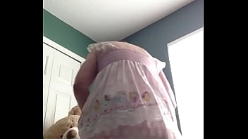 ABDL diapered sissy in pretty pink dress with teddybear