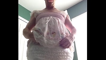 ABDL diapered sissy in pretty pink dress with teddybear