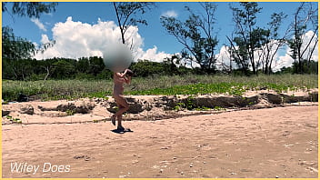 Wife plays football nude at public clothed beach