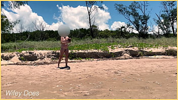 Wife plays football nude at public clothed beach