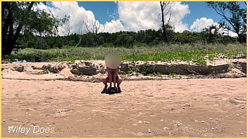 Wife plays football nude at public clothed beach