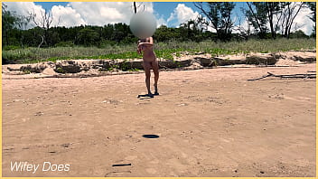 Wife plays football nude at public clothed beach