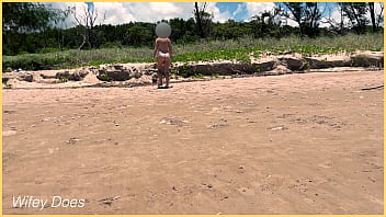 Wife plays football nude at public clothed beach