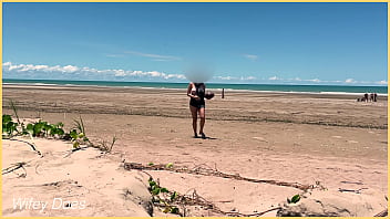 Wife plays football nude at public clothed beach