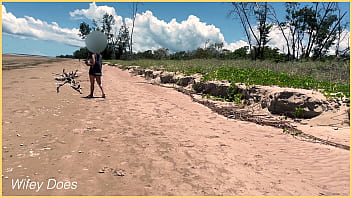 Wife plays football nude at public clothed beach