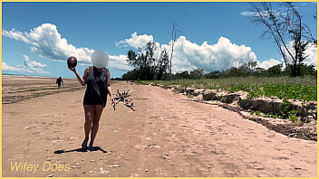 Wife plays football nude at public clothed beach