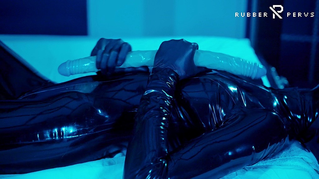 tied up rubber girl in catsuit fucking herself