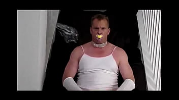 Diapered sissy in choker and chastity