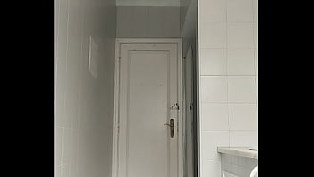 Sexy guy in black beach shorts shaving