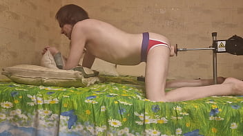 Nude gay on the bed with fuck machine