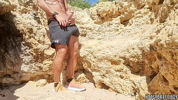 Sexy guy masturbating his big cock in a public beach - Almost Caught