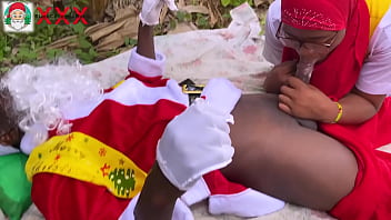 Nigeria Santa Claus exchanges gift with a girl who just returned from boarding school to spend Christmas holidays