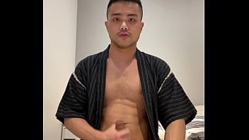 Asian boy in Jinbei stroking
