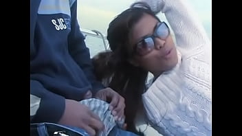 Ebony chick with glasses licks and sucks a horny guy's big dick on a yacht in the sea
