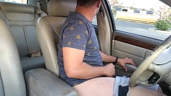 Hippie guy jerking off and fingering ass in the car in public