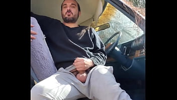 Hippie having fun in the car out in public.