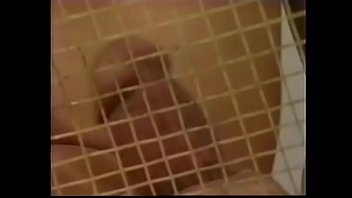 Tennis player likes to loosen his penis stiff muscles after excercises with ball shooter machine and drop his load on his tennis racket