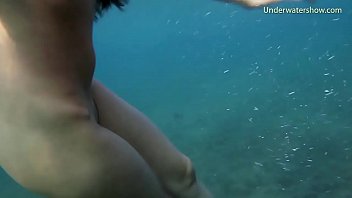 Underwater in the sea babes enjoy themselves