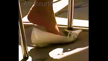 Candid Feet, girl relaxes barefoot and plays with her sweaty toes, looks at her sweaty stinky flats.